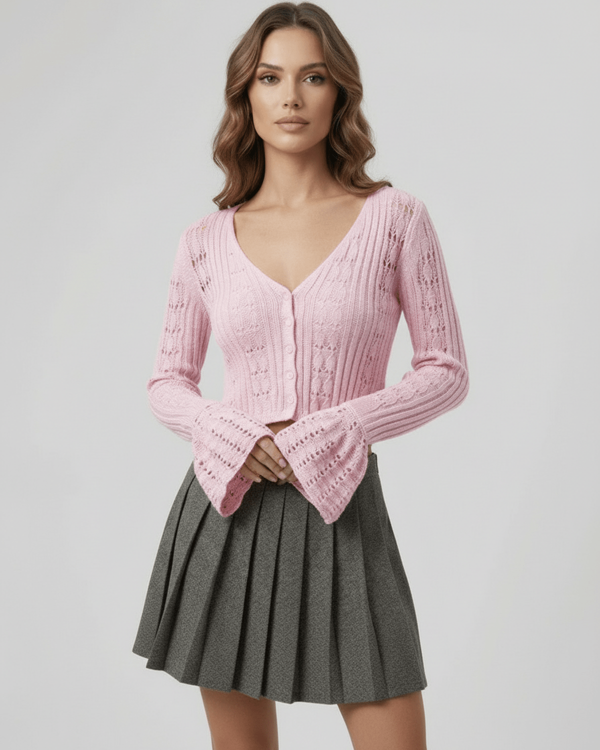 Roselle Cardigan: Soft pink cropped sweater with refined openwork detailing, by Lauven, perfect for a feminine everyday look.