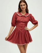 Lauven Rosette Mini Dress featuring Peter Pan collar and puff sleeves in a chic silhouette.
