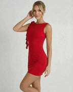 Model wearing a Ruby Mini Dress by Lauven, bold red sleeveless bodycon with ruffle detail, perfect for summer occasions.