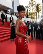 Elegant woman in a Scarlet Maxi Dress by Lauven with floral sequin detail on the red carpet.