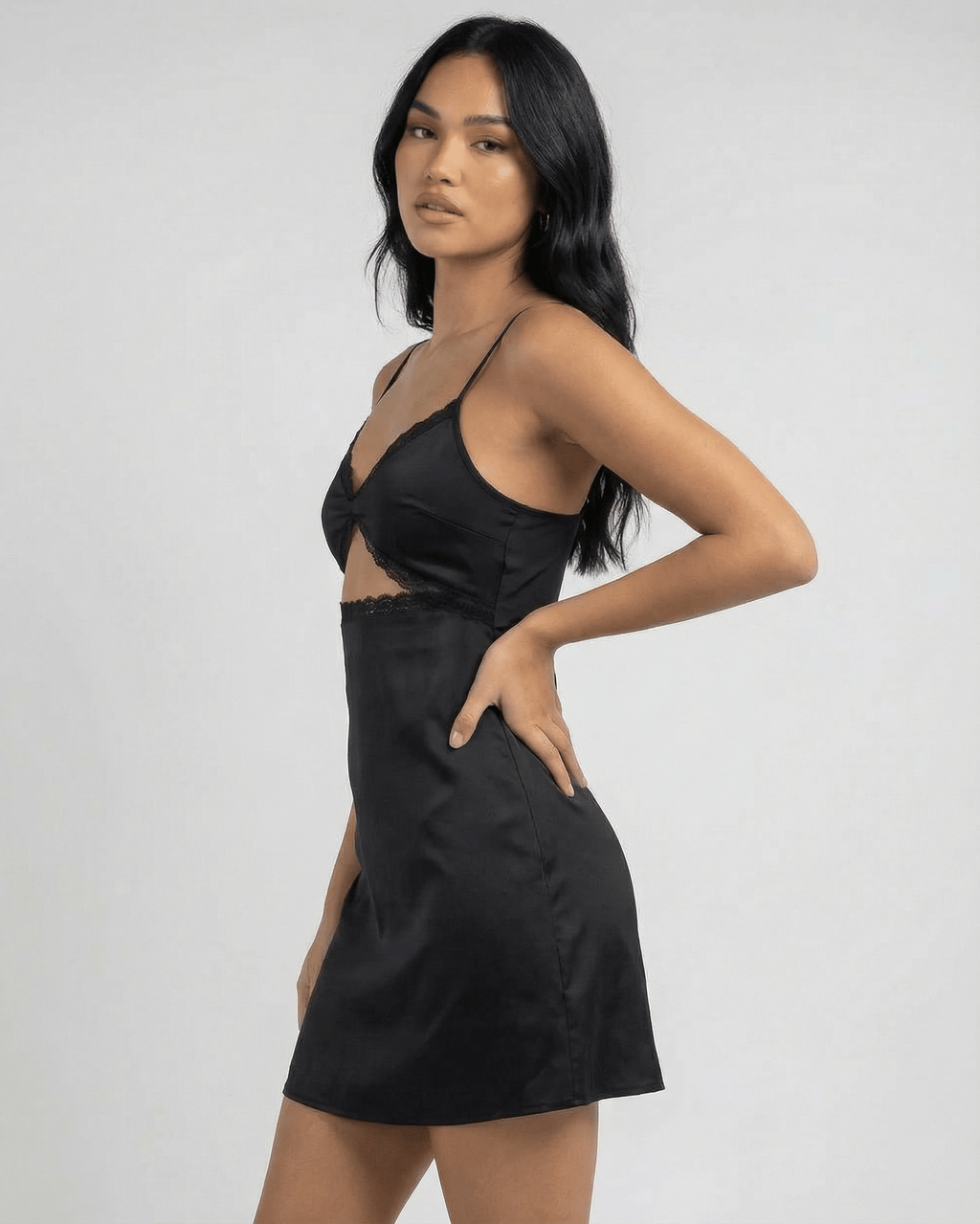 Selene Mini Dress by Lauven featuring lace trim and spaghetti straps on a model in profile.