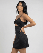 Selene Mini Dress by Lauven featuring lace trim and spaghetti straps on a model in profile.