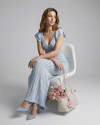 Sienna Maxi Dress by Lauven, featuring a light blue lace design, V-neck and ruffle sleeves, perfect for elegant occasions.