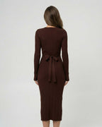 Sienna Midi Dress by Lauven, showcasing the back view of a ribbed long sleeve bodycon design.