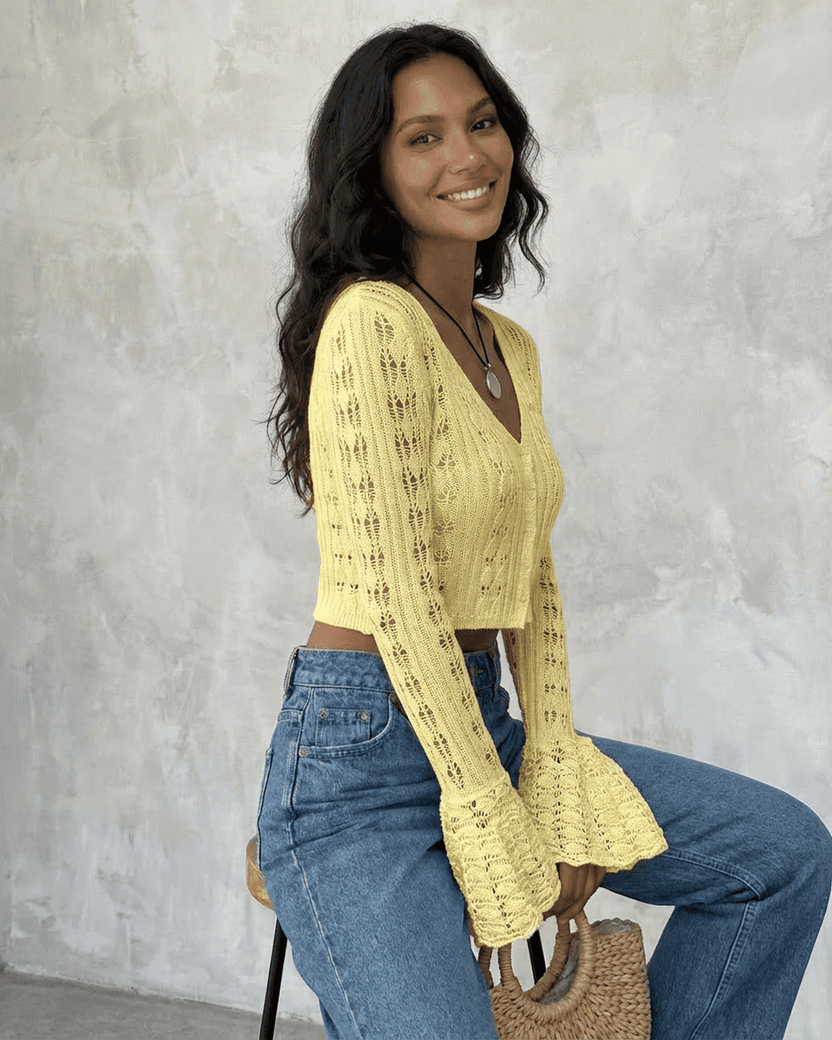 Solana Cardigan by Lauven, a cropped cotton knit with flare sleeves and breathable hollow-out detailing.