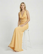 Solara Maxi Dress by Lauven, a satin-effect cowl neck bodycon maxi dress in a soft yellow color.