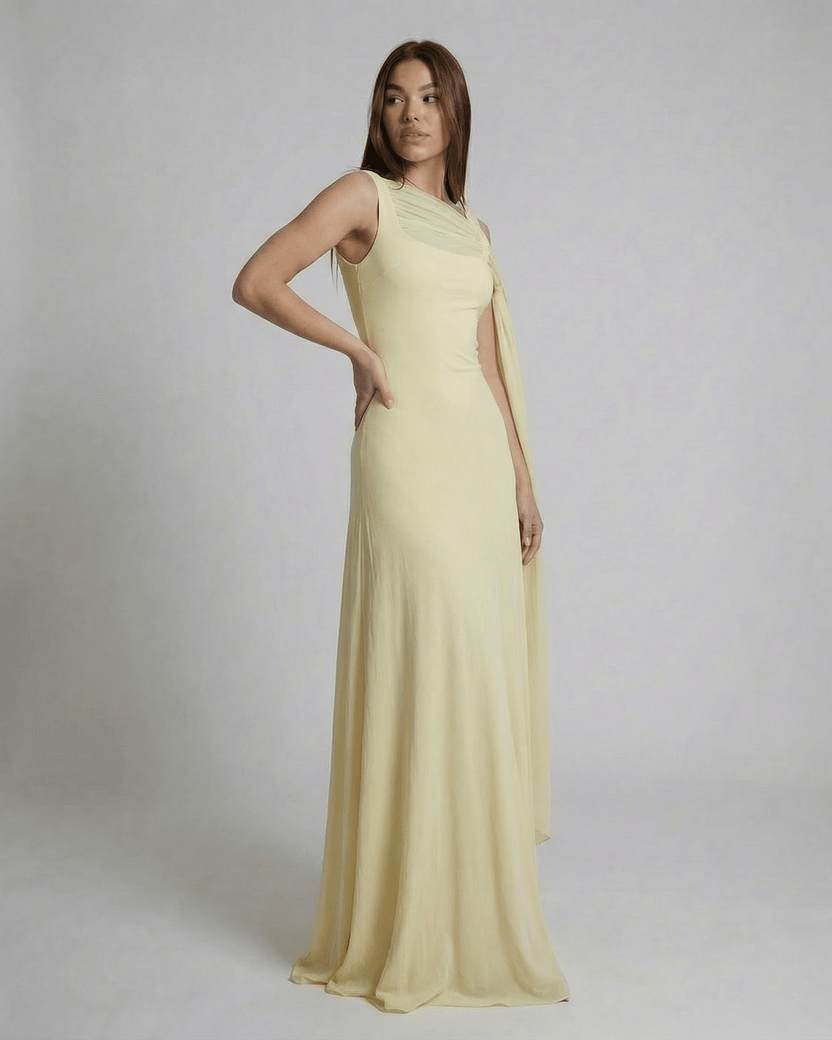 Solenne Maxi Dress by Lauven, showcasing a light yellow sleek slip with mesh shawl detail and square neck.