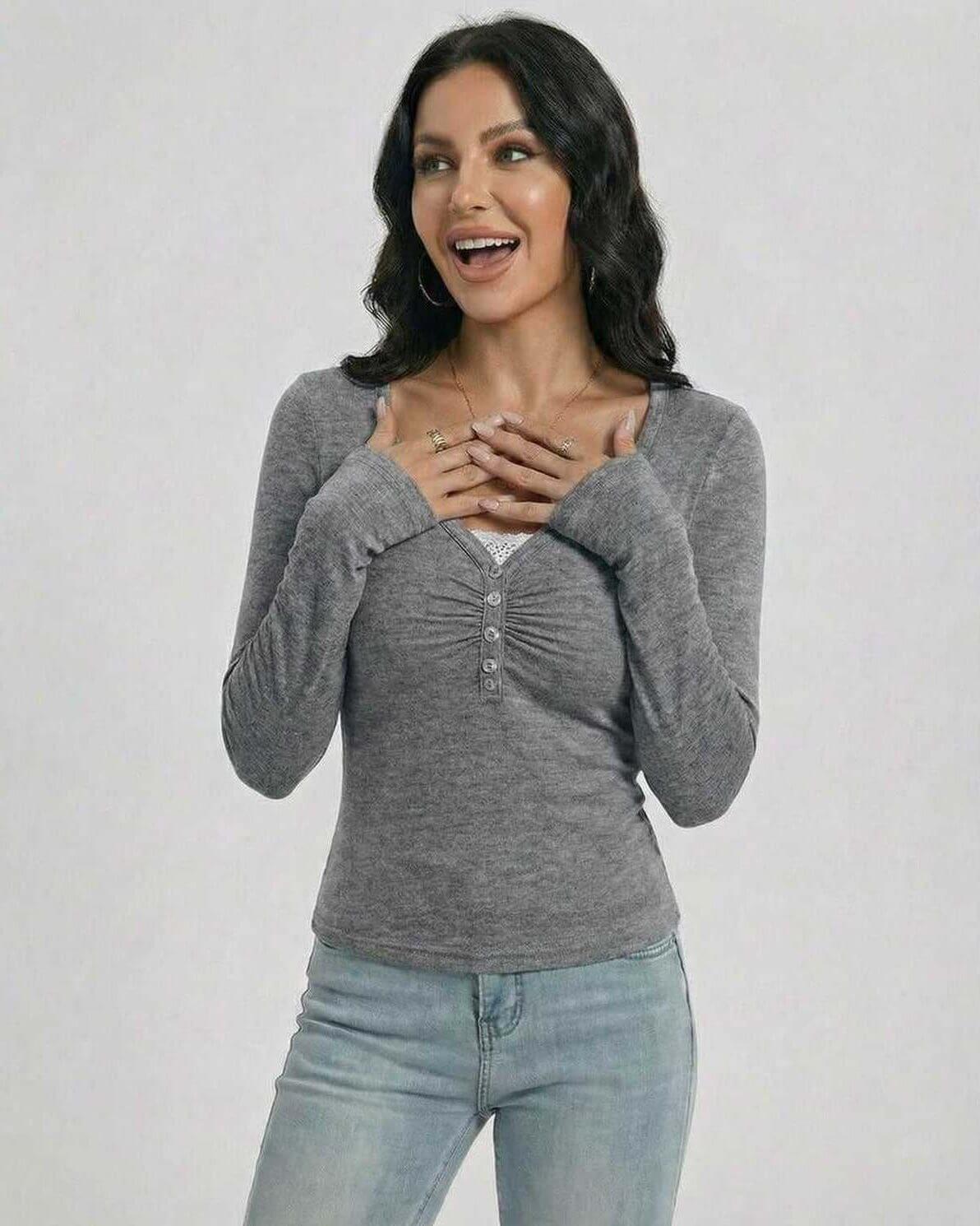 Woman wearing a Sterling Pullover by Lauven, showcasing a slim fit, V-neck design with button detailing.