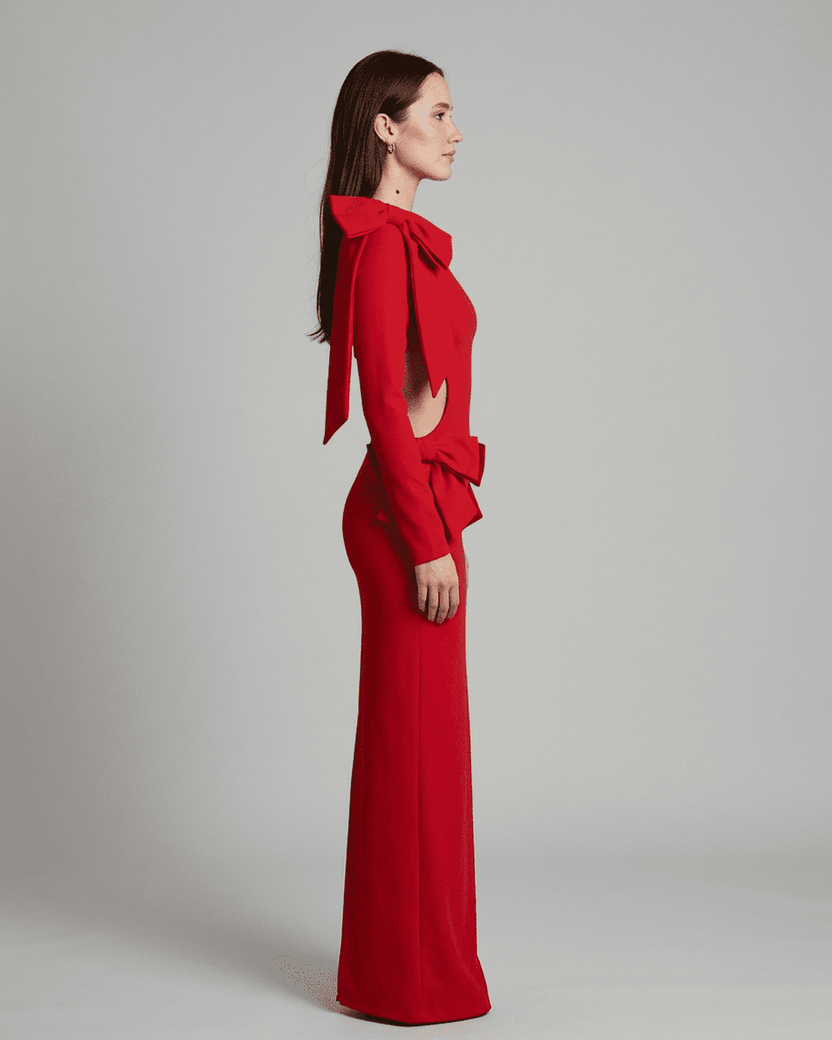 Valencia Maxi Dress by Lauven, showcasing long sleeve bodycon silhouette with cut-out waist and sculptural bows, in red.