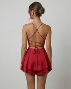Valeria Mini Dress by Lauven featuring a satin finish, A-line silhouette, and strappy back design in rich red.