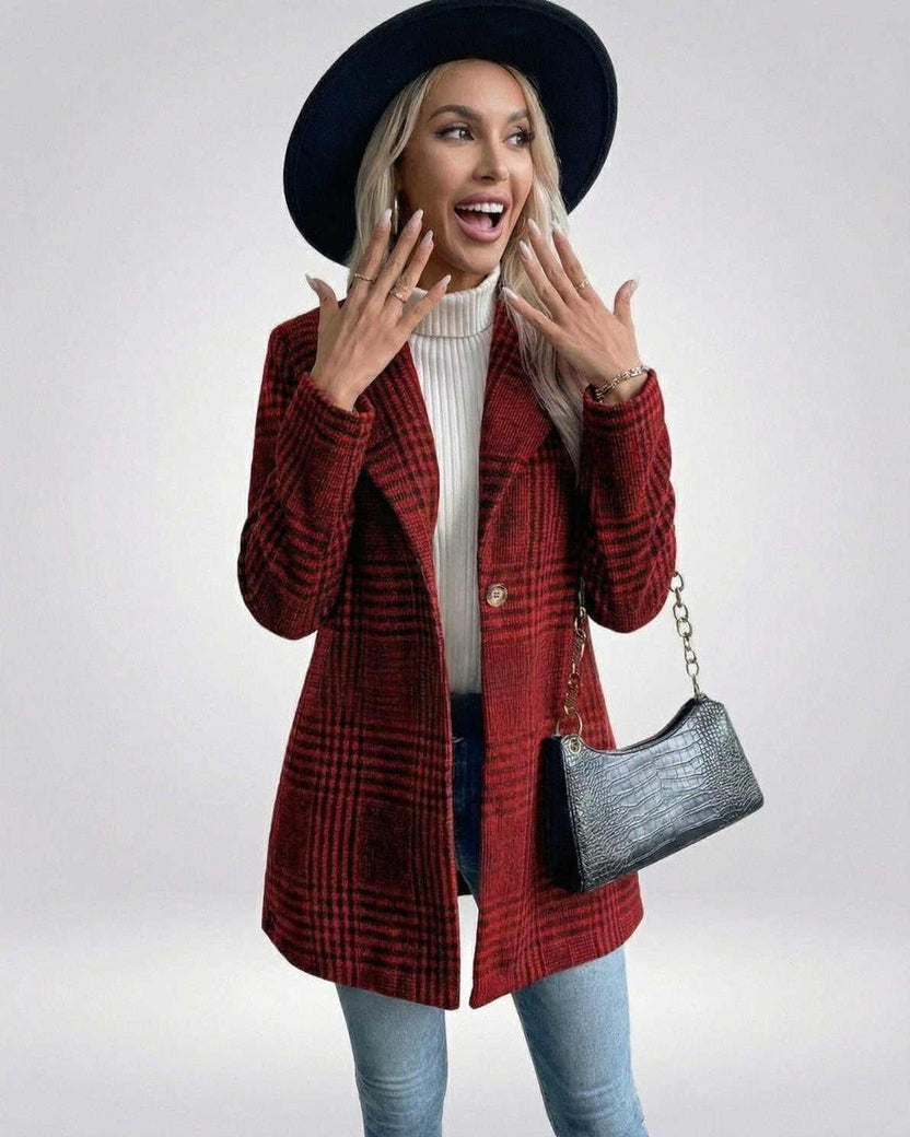 Woman wearing Lauven Verona Jacket, a stylish red plaid jacket, with excitement in a modern setting.