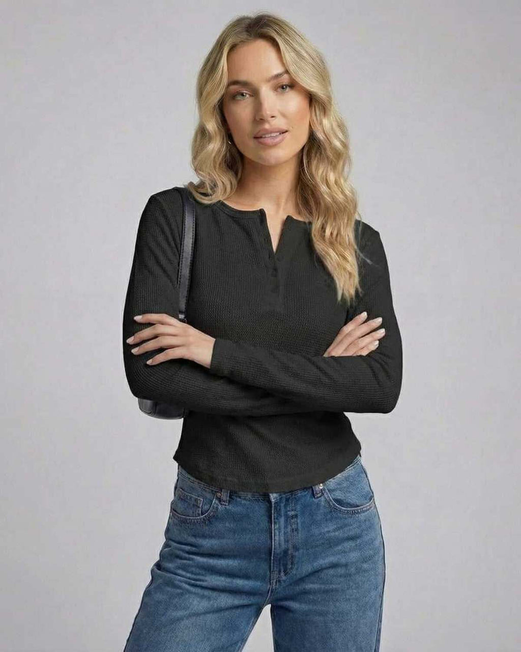 Vesper Long Sleeve top by Lauven, black long sleeve henley with button placket, styled with jeans.