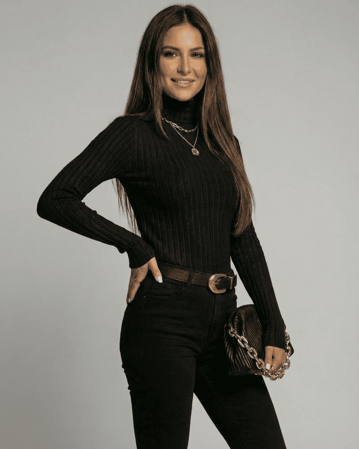 Vesper Sweater by Lauven, ribbed turtleneck slim fit knitwear in black, styled with jeans and accessories.