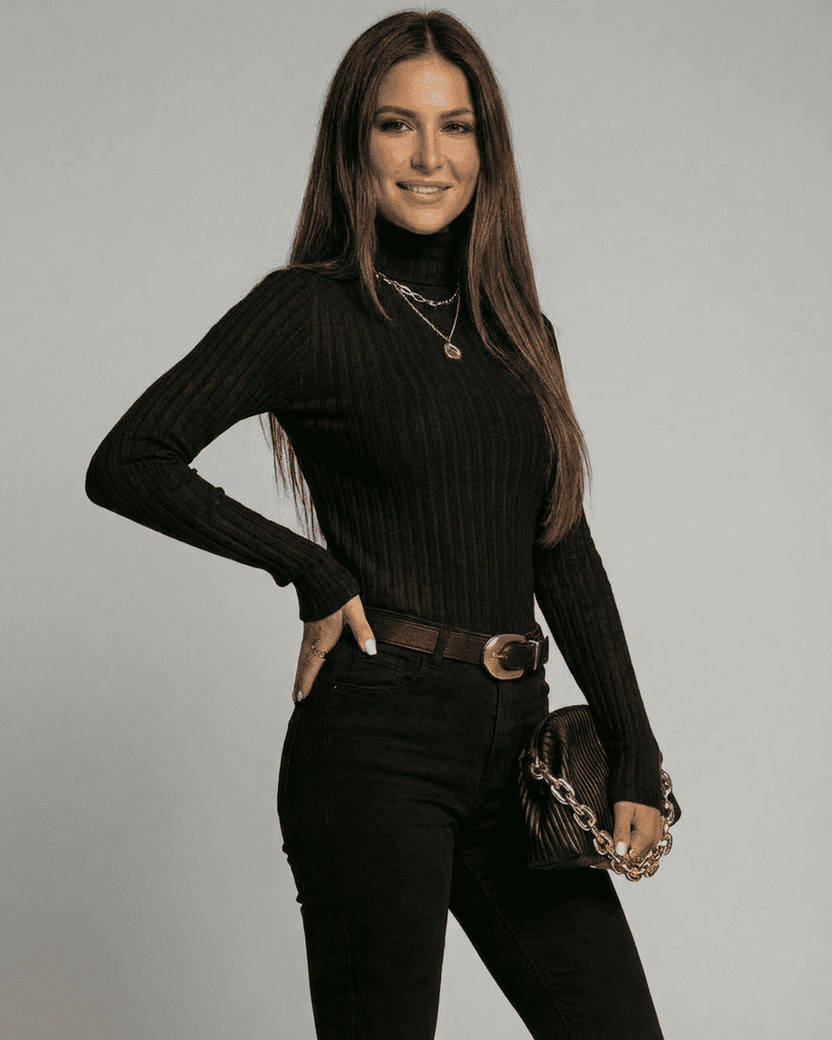 Vesper Sweater by Lauven, ribbed turtleneck slim fit knitwear in black, styled with jeans and accessories.