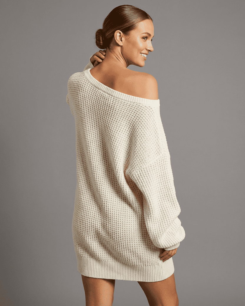 Model wearing the Aurora Mini Dress by Lauven, showcasing the off-the-shoulder design and cozy knit fabric.