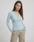 Lauven Luna Long Sleeve – Women’s blue long sleeve top with a slim fit ribbed design and half-open neckline.