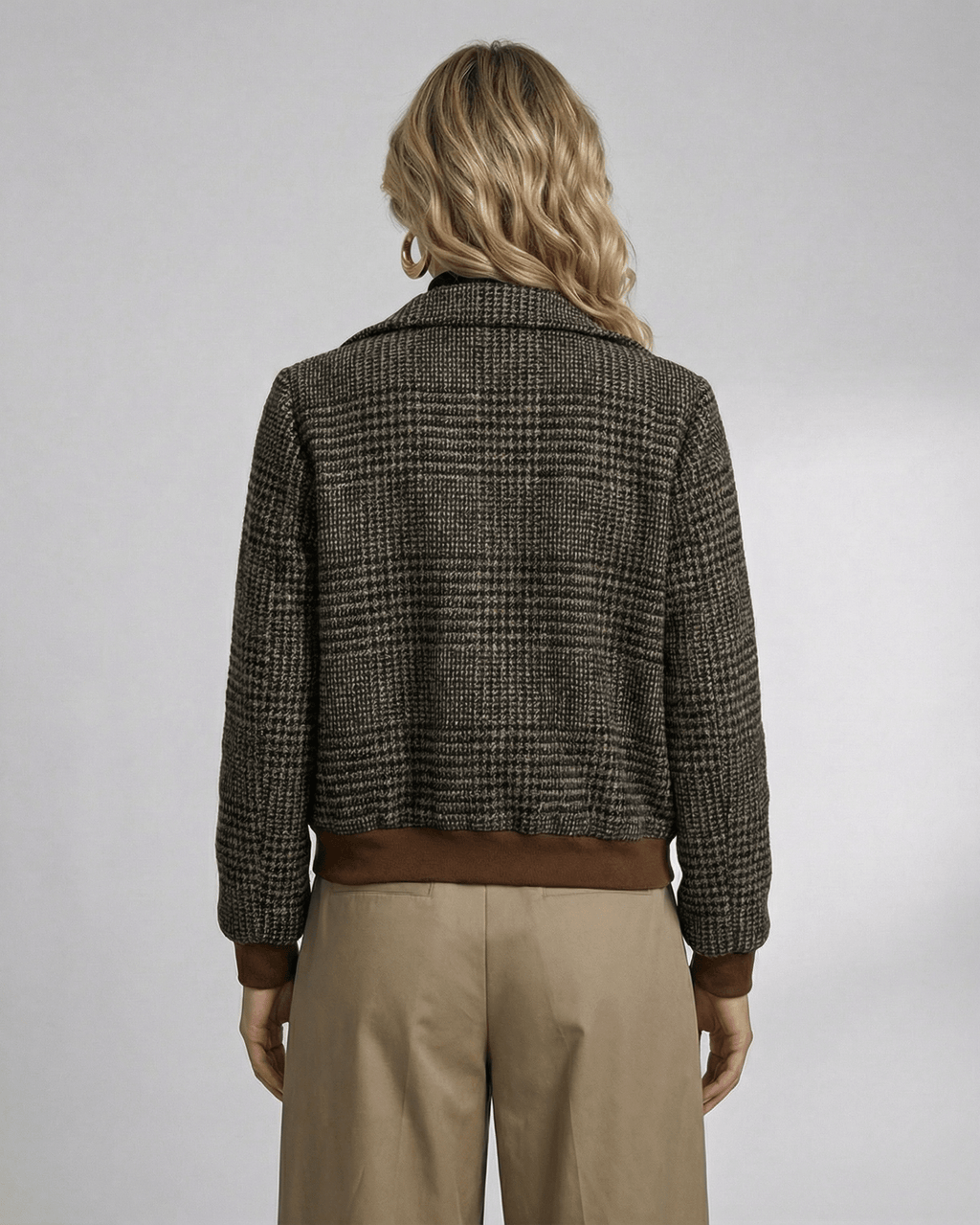 Back view of a woman in a Lauven Cambridge Jacket featuring a plaid design and stylish lapel collar.