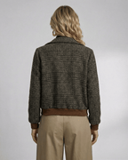 Back view of a woman in a Lauven Cambridge Jacket featuring a plaid design and stylish lapel collar.