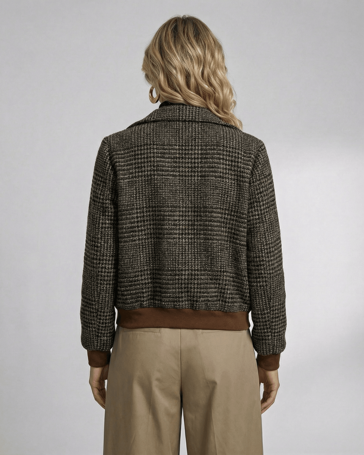 Back view of a woman in a Lauven Cambridge Jacket featuring a plaid design and stylish lapel collar.