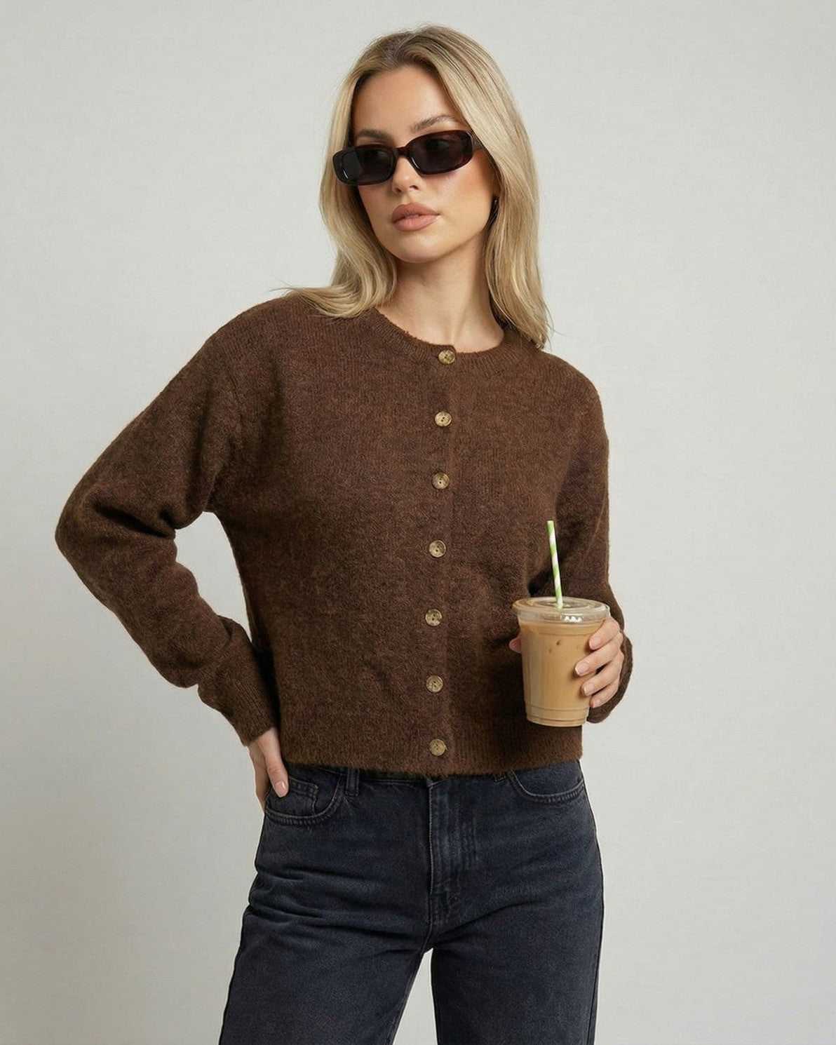 Cocoa Cardigan by Lauven worn by a woman with sunglasses, holding an iced coffee, showcasing a relaxed fit.