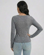 Back view of a woman wearing the Lauven Sterling Pullover in gray, showcasing its slim fit and long sleeves.