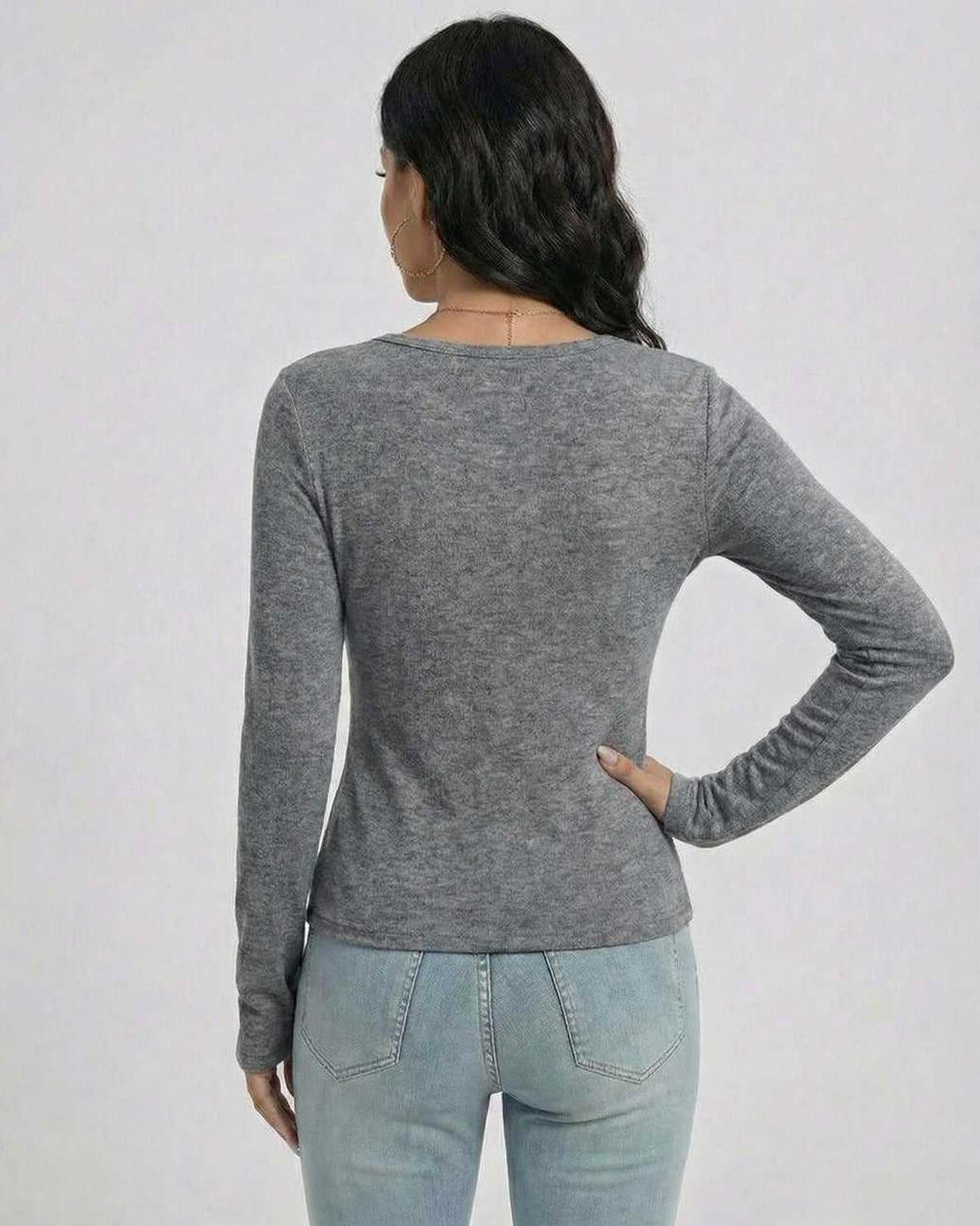 Back view of a woman wearing the Lauven Sterling Pullover in gray, showcasing its slim fit and long sleeves.
