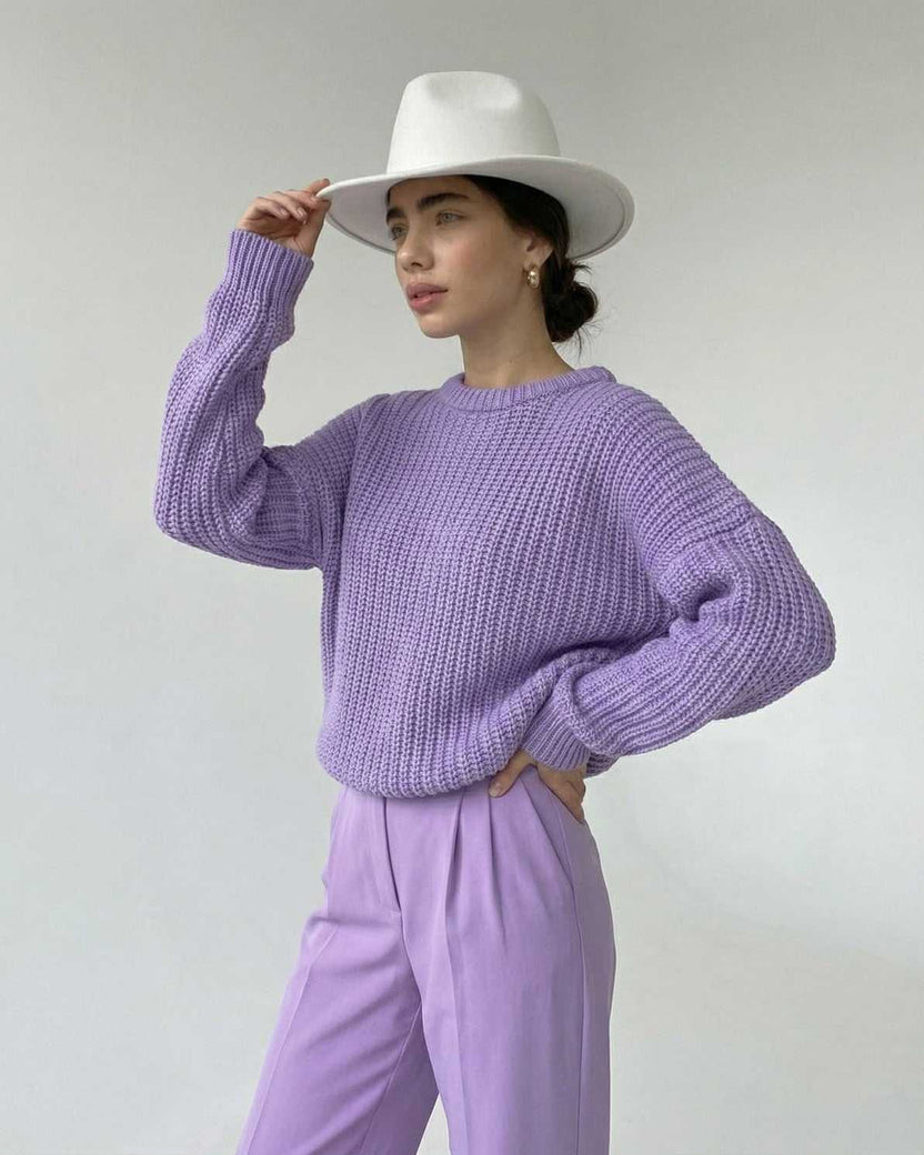Lavande Sweater in lavender, textured knit and relaxed fit. Stylish woman wearing a chic hat.