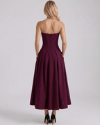 Elegant back view of Aveline Midi Dress, showcasing the structured polyester, V-neck design, and flowing skirt from Lauven.