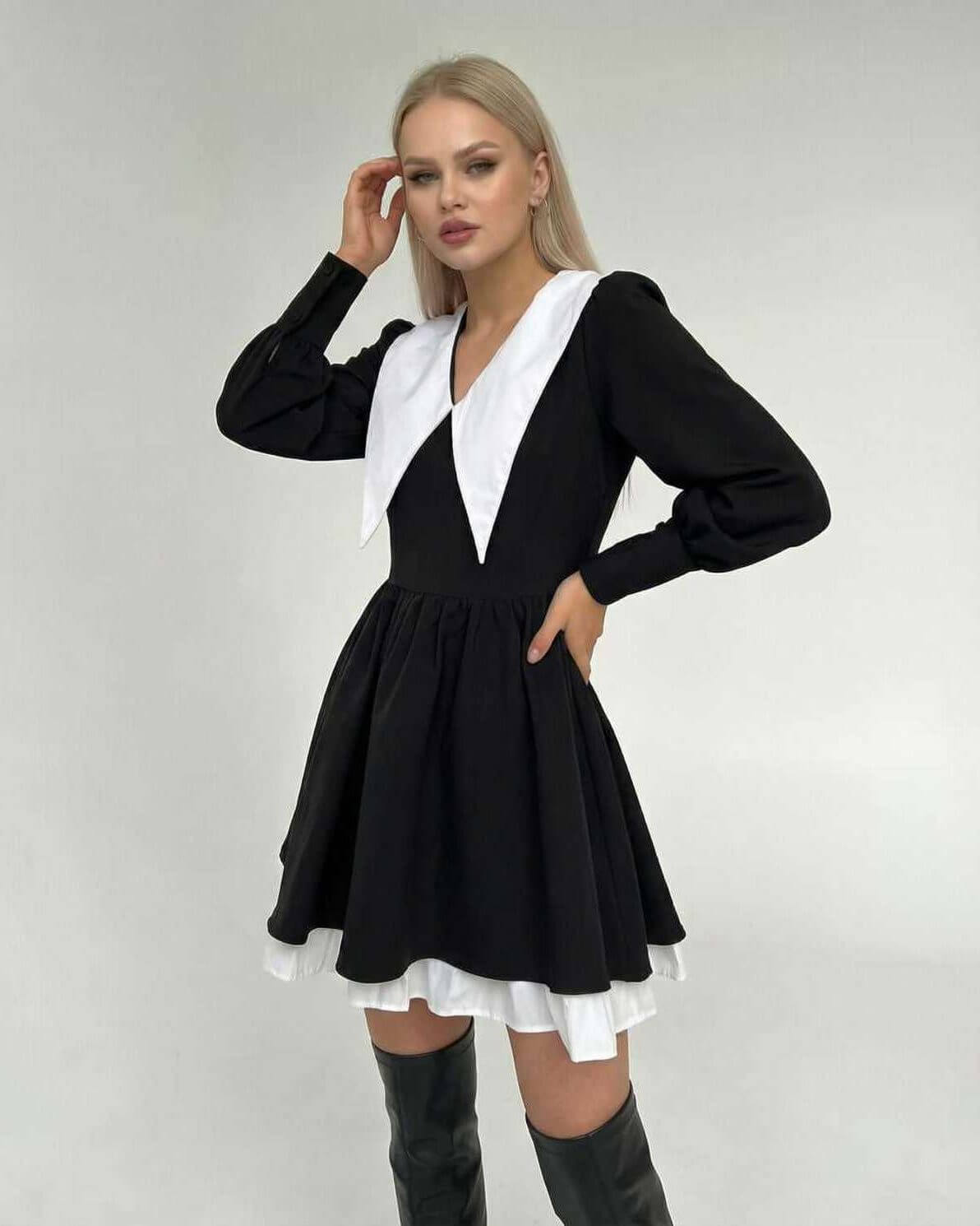 Vesper Mini Dress by Lauven featuring chic black and white patchwork design with lapel collar and flowing skirt.
