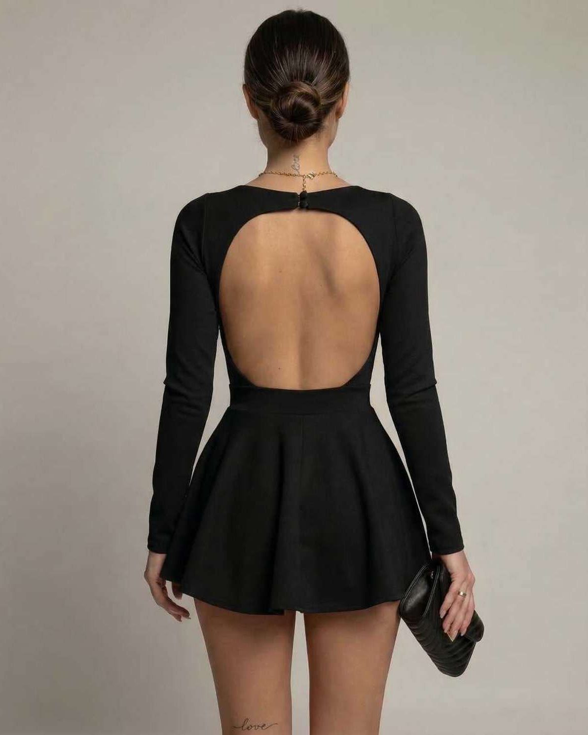 Vivian Mini Dress by Lauven, featuring a deep V-neckline and flared skirt in classic black.