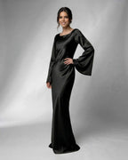 Liora Maxi Dress by Lauven features a sleek satin fabric and elegant bell sleeves, perfect for special occasions.