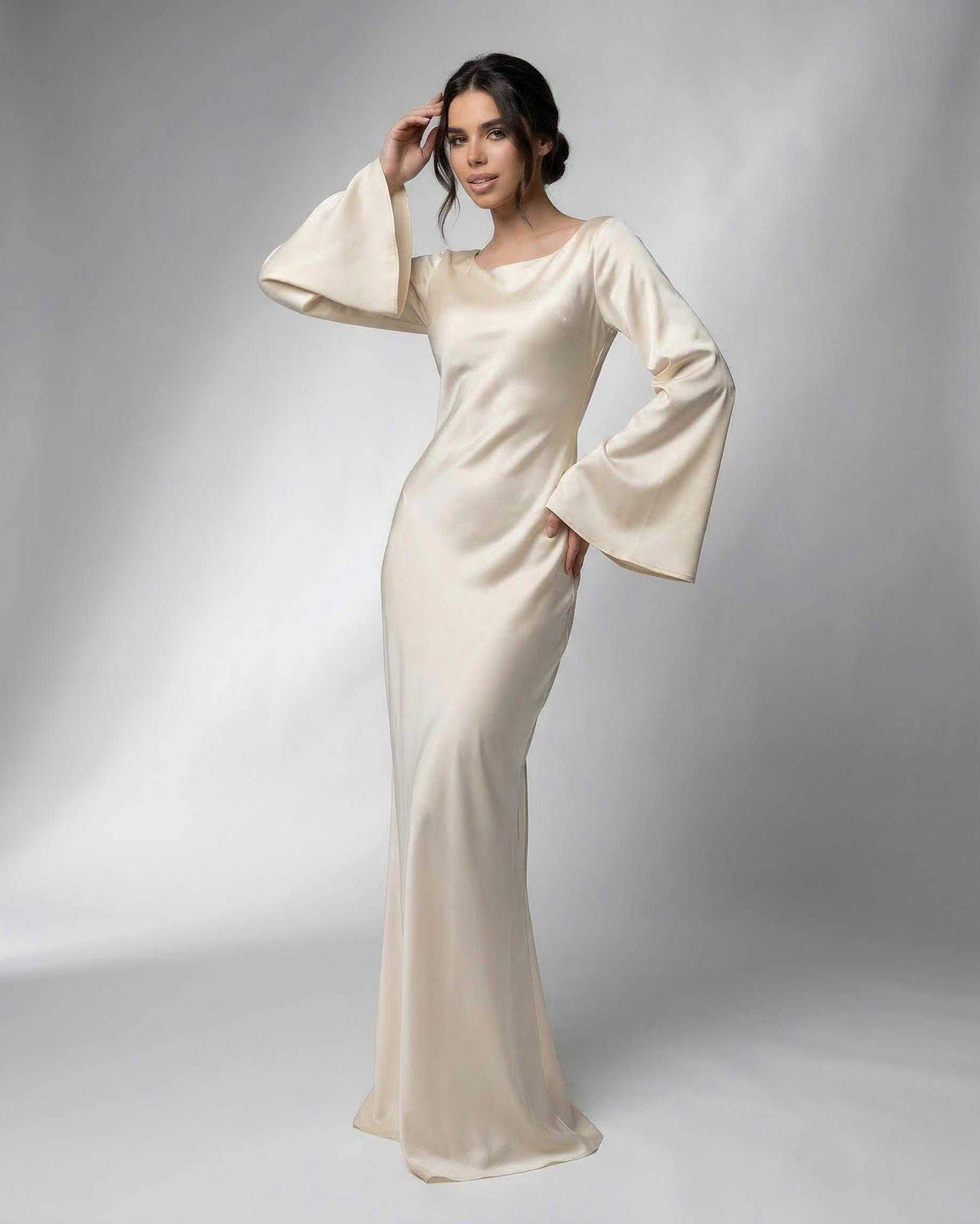 Liora Maxi Dress by Lauven featuring elegant bell sleeves and a flowing silhouette in luxurious cream satin.