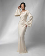 Liora Maxi Dress by Lauven featuring elegant bell sleeves and luxurious satin fabric in a refined cream tone.