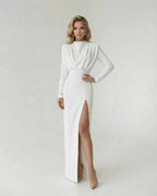 Liora Maxi Dress by Lauven, elegant fit and flare white dress with high side slit and long sleeves.