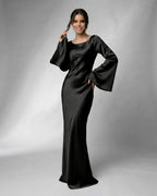 Liora Maxi Dress by Lauven featuring a sleek satin design and elegant bell sleeves in black.