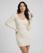 Liora Mini Dress by Lauven in soft cream, featuring a ribbed knit and V-neck for a modern elegant look.