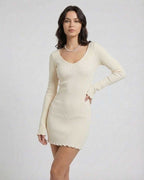 Model wearing Liora Mini Dress in Soft Cream with Ribbed Knit and V-Neck, by Lauven.