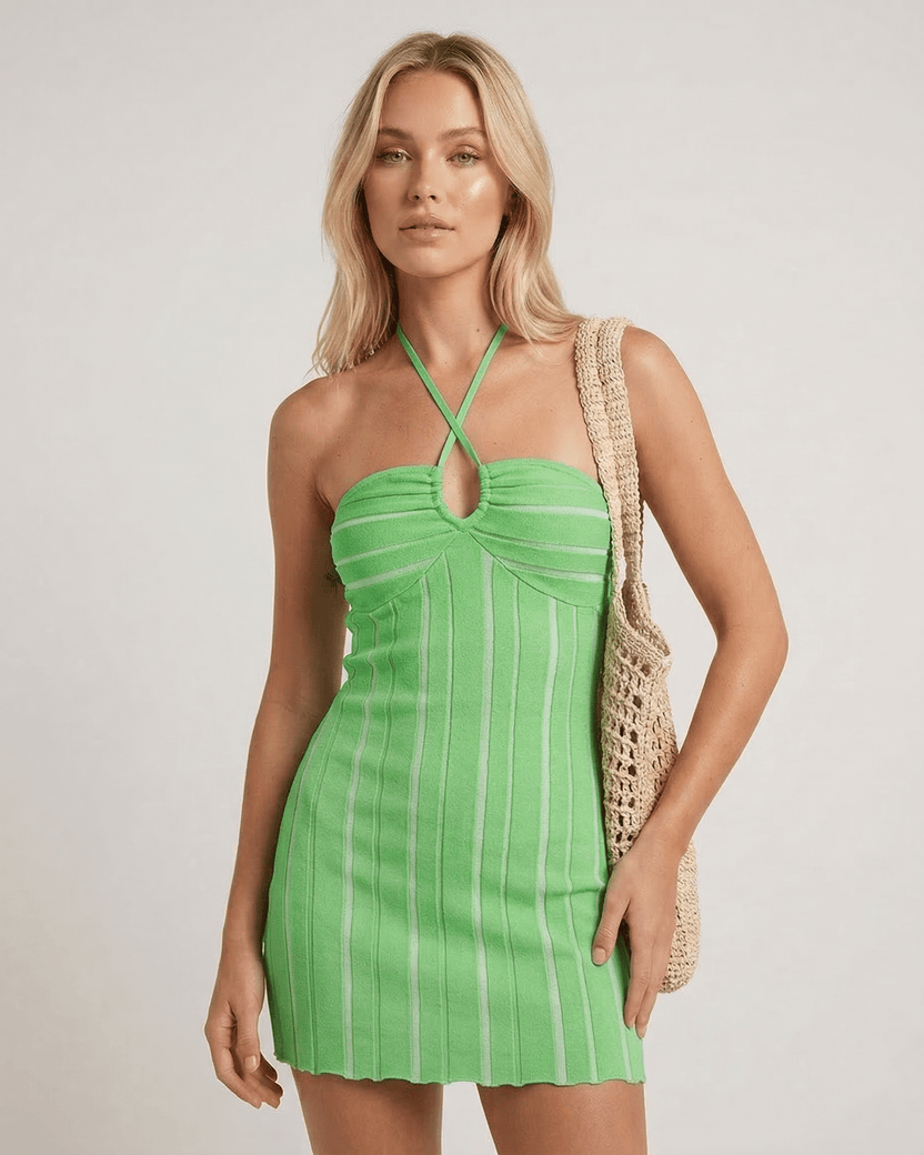 Liora Mini Dress by Lauven in vibrant green with halter neck and vertical ribbing, showcasing a flattering silhouette.