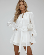 Lumiere Mini Dress by Lauven featuring a 3D floral belt, flare sleeves, and elegant white fabric.