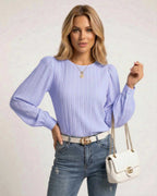 Luna Blouse by Lauven in soft lavender, featuring elegant vertical pleats and bishop sleeves.