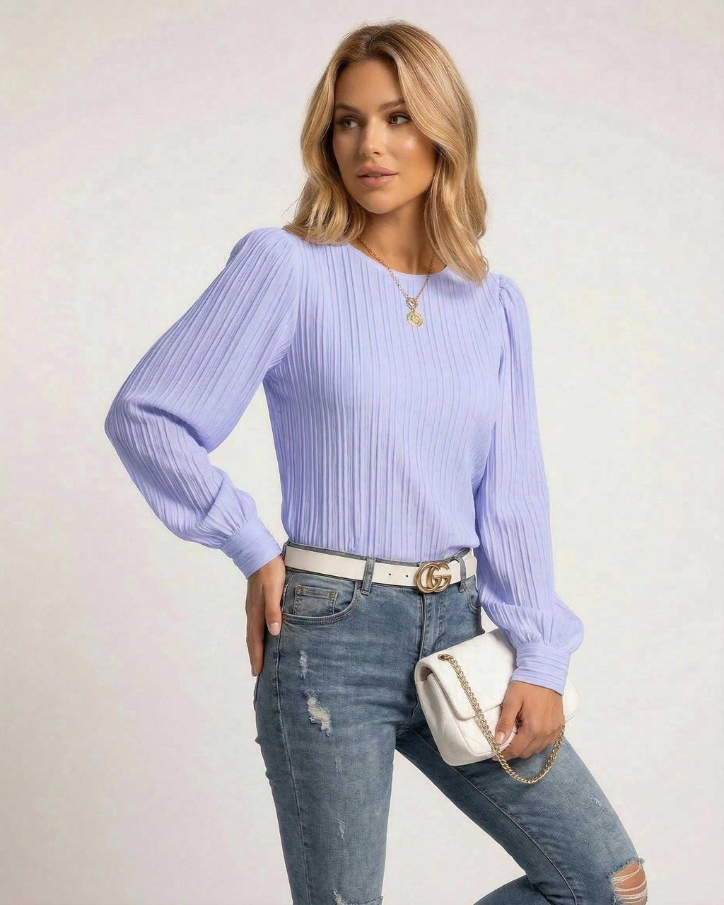 Luna Blouse by Lauven in soft lavender with pleated long sleeves, styled with jeans and a white handbag.