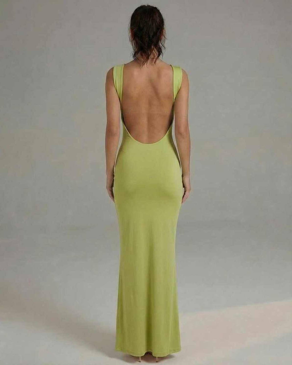 Luna Maxi Dress showcasing a sleek lime green satin silhouette with a flattering open back design by Lauven.
