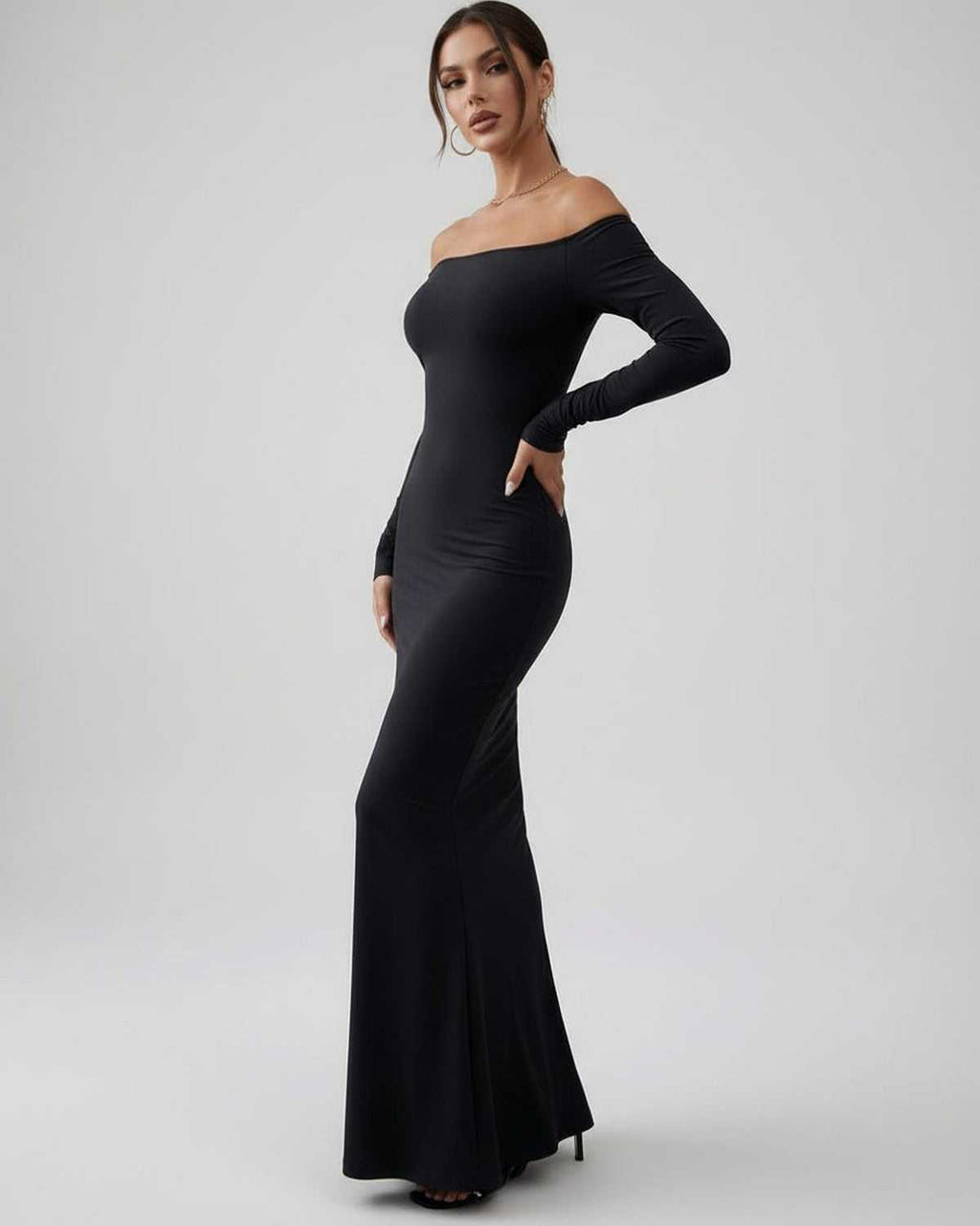 Lauven Luna Maxi Dress featuring sleek off-shoulder long sleeves in classic black, showcasing a sophisticated silhouette.