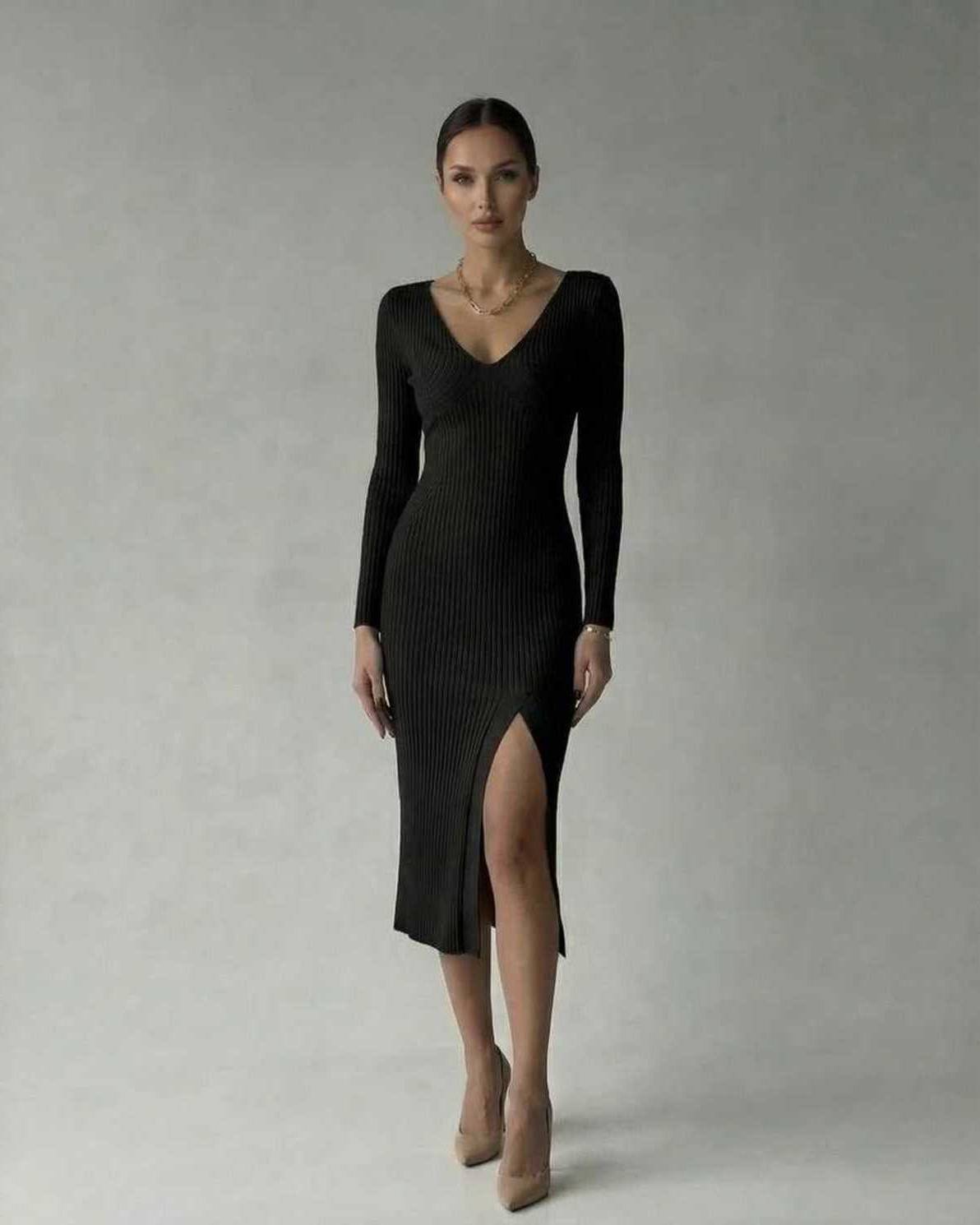 Lauven Luna Midi Dress in black, ribbed knit V-neck design, featuring a thigh-high slit for a sophisticated look.