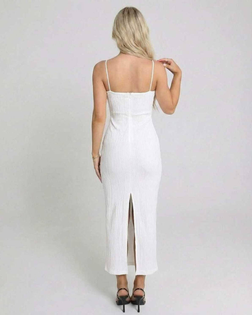 Back view of a woman wearing the Lauven Luna Midi Dress, showcasing its sleek design and back slit.