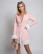 Luna Mini Dress featuring soft blush pink and crisp white ruffles by Lauven, offering a luxurious feel and modern style.