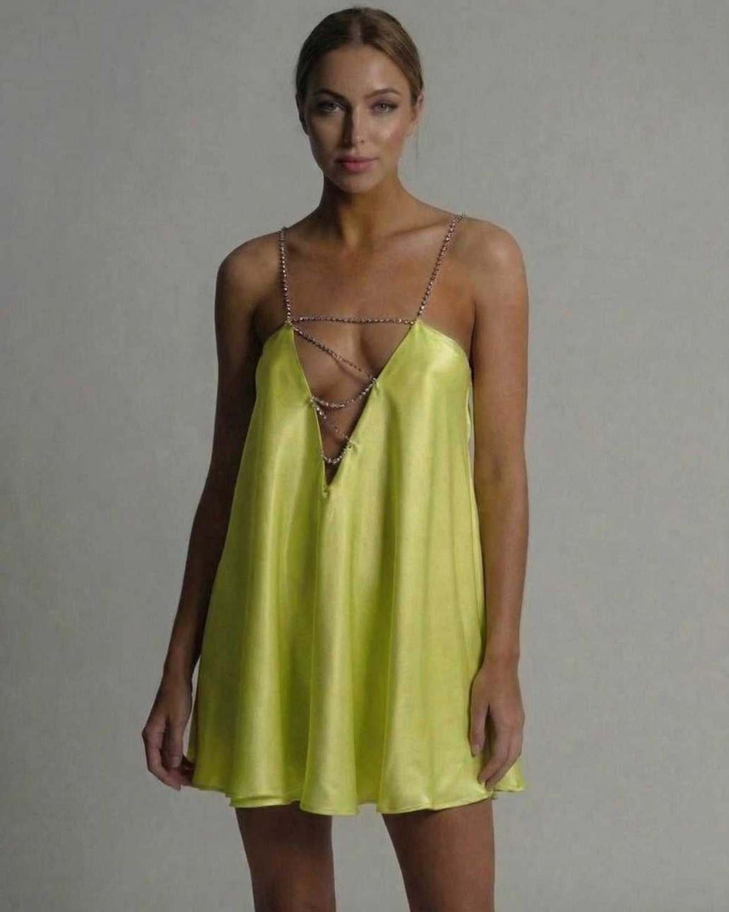 Lauven Luna Mini Dress in vibrant chartreuse satin with flared silhouette and beaded spaghetti straps.
