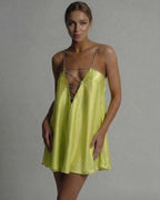 Luna Mini Dress by Lauven in vibrant chartreuse hue featuring beaded spaghetti straps and flared satin silhouette.