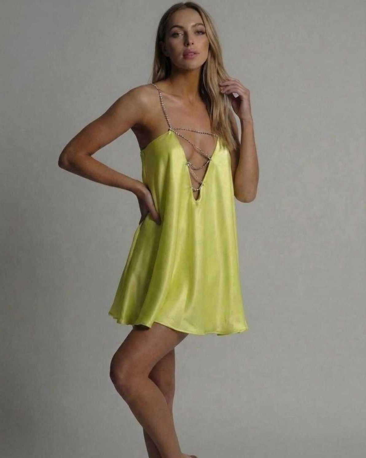 Luna Mini Dress by Lauven in vibrant chartreuse with shimmering beaded spaghetti straps and flared skirt.