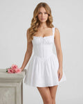 Lauven Luna Mini Dress in white cotton blend with structured bodice and pleated skirt, perfect for summer occasions.